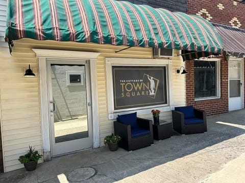 Shaded front porch with chairs