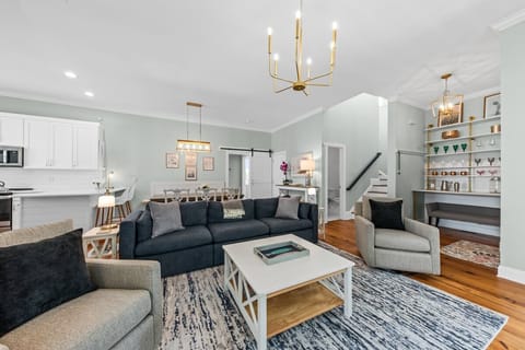 The living area is open to the kitchen and dining room.  Painted in a serene palate.