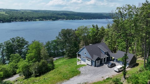 Perched above the water, enjoy breathtaking lake views from nearly every room of this hilltop haven 🌊🏞️