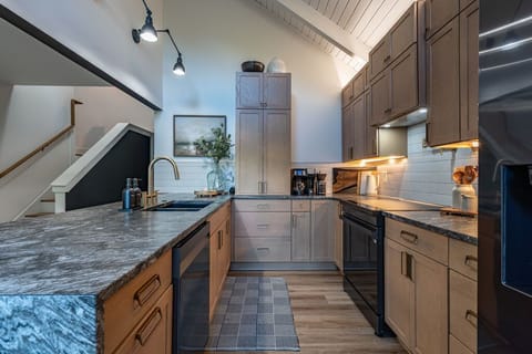 Our fully stocked kitchen features high-end appliances and ample cooking space—perfect for preparing delicious meals and enjoying quality time together.