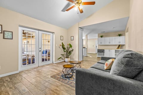 Just minutes away from the plush sofa, you’ll find the fully stocked kitchen — and right in front, easy access to the backyard for seamless indoor-outdoor living.