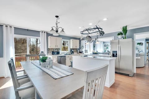 A spacious open floor plan seamlessly connects the kitchen and dining area—perfect for cooking, entertaining, and gathering.