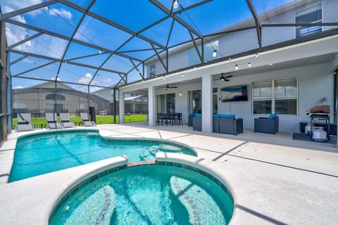 Sparkling screened-in pool ready for a sunny afternoon swim.
