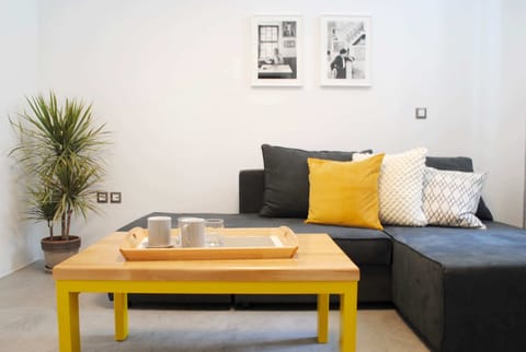 Modern Living Room with Stylish Sofa & Natural Light

