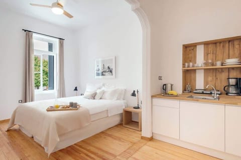Open-Plan Kitchen & Dining Area – Bright and fully equipped with direct access to the bedroom.

