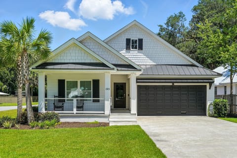 1913 3rd Ave Front Exterior - Classic curb appeal, wide driveway, and a Redfern Village area address introduce the home.