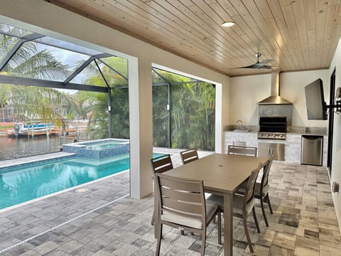Very Large outdoor area! Spa Heated Pool grill & TV! 