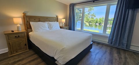 Comfortable queen bed with crisp linens for a restful night