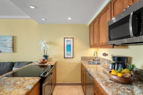Fully furnished kitchen with stainless steel appliances, and granite countertops