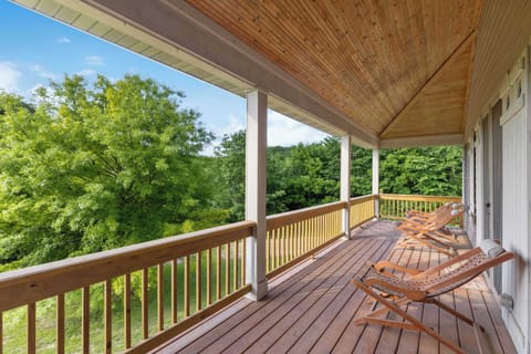 Relax on the upper floor balcony after a long day of sightseeing in quaint Galena
