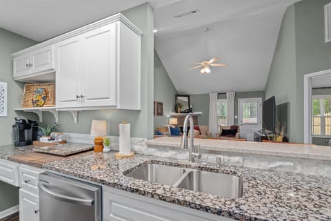 View from kitchen into living room and dining area