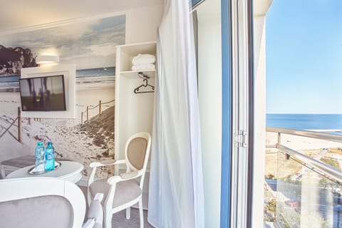 Deluxe Double Room, Sea View | Minibar, in-room safe, desk, laptop workspace