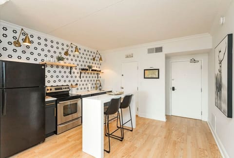 Unit 1 - Fully-stocked, updated kitchen with all cooking essentials, seating for 2 at the counter and separate room with a coffee bar.