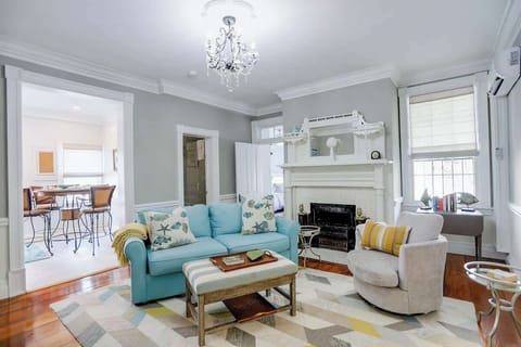 Light and airy - Our living room includes a TV, beautiful, original hardwood floors, and cozy decor. It is convenient and outfitted with all the conveniences of home.