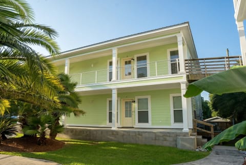 Charming coastal home with double porches and tropical curb appeal