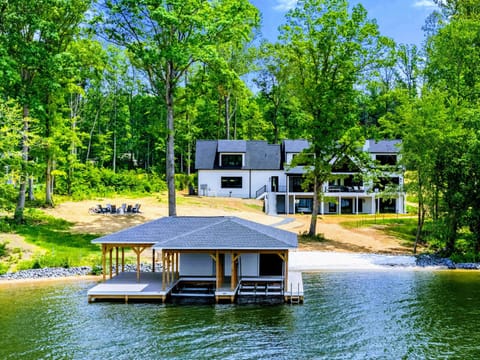 Backyard - A private shoreline surrounded by mature trees and calm water, perfect for slow mornings and peaceful evenings by the lake.