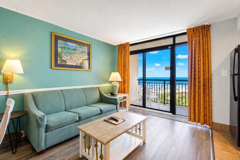 Beautifully decorated oceanfront living room at Beach Cove Resort, ready for an unforgettable family getaway.