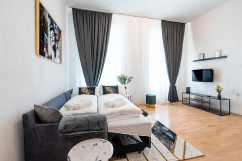 Design Apartment, Pets Allowed, City View | Living area | 43-inch Smart TV with digital channels