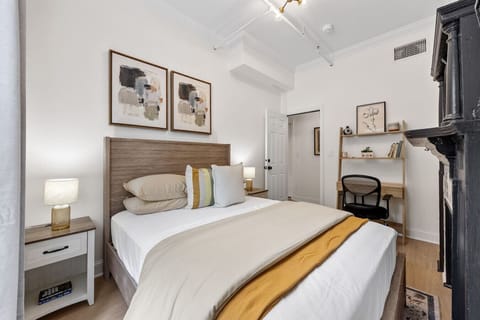 Relax and unwind in this cozy and stylish bedroom! Featuring a comfortable queen-sized bed, a dedicated workspace for your convenience, and beautiful natural light.