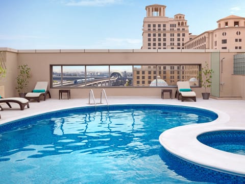 Outdoor pool, pool umbrellas, sun loungers