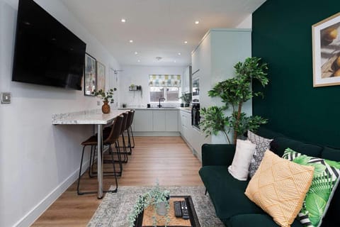 Relax with friends and family in this luxury living room with a TV