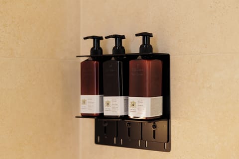 Shower, hair dryer, slippers, towels