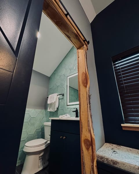 Bathroom with unique tile and smart mirror