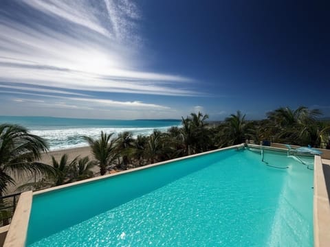 Outdoor pool, open 9:00 AM to 7:00 PM, pool umbrellas, sun loungers