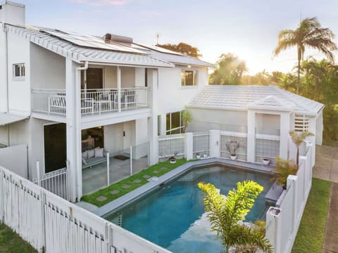 Private front yard featuring a fully fenced swimming pool, sunlit surrounds and outdoor seating. Designed for relaxation and family enjoyment, offering a resort-style feel with space to unwind and entertain.