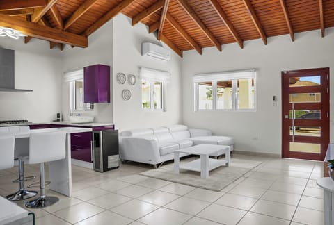 Large, bright living room with high ceiling.