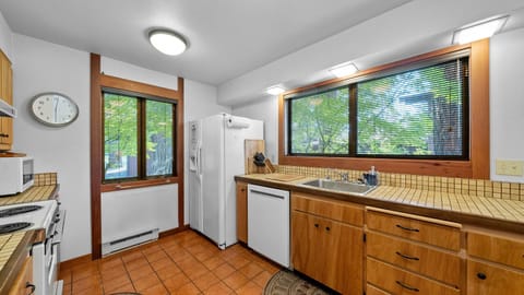 The sparkling vintage kitchen blends nostalgic charm with everyday comfort.