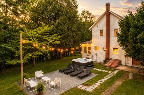 Soak in the hot tub as the string lights come on at dusk. Loungers and a small seating area nearby give you a spot to unwind before or after your soak.