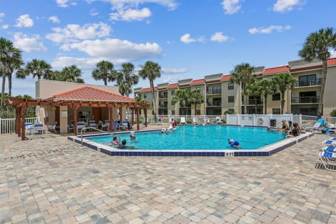 - Large resort style pool surrounded by lounge chairs and palm trees inviting  
- Shaded cabana and open deck make it great for swimming relaxing and family  
- A highlight amenity where guests gather for fun sunny vacation memories  

