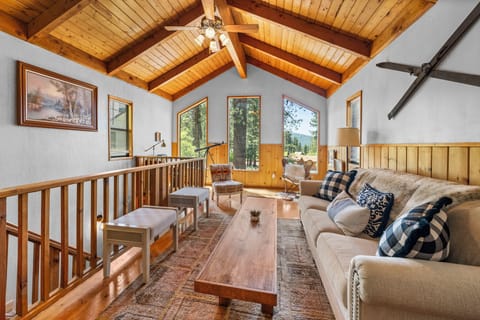 Upstairs Living Room - Upstairs Living Room with beautiful windows looking out on peekaboo lake views