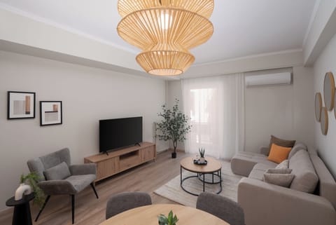 Superior Apartment, 2 Bedrooms, Balcony, City View | Living room | 50-inch TV with cable channels