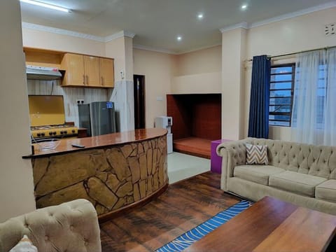 Comfort Apartment, City View | Living area | 24-inch Smart TV with digital channels