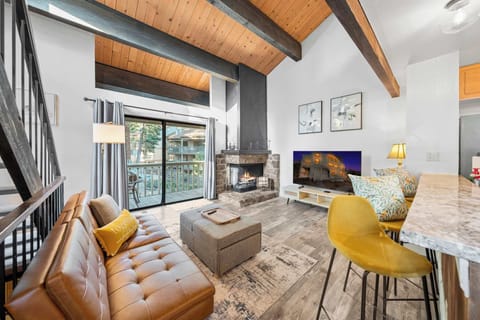 Cozy and spacious living area with smart TV & fireplace