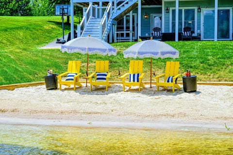 Beach Chairs - A lineup of yellow Adirondacks faces the water, ready for the whole group to claim one and stay a while.