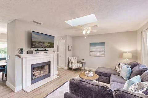 Cozy up in the stylish living room, where natural light, plush seating, and a smart TV create the perfect space for movie nights or relaxing after a day of adventure.