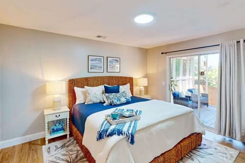 Unwind in the serene primary bedroom featuring a luxurious king bed, soft linens, and a private ensuite bath—your personal retreat after a day exploring Savannah.
