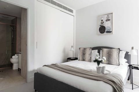 A master bedroom with a queen sized bed & en-suite.