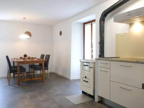 Furniture, Flooring, Interior Design, Floor, Wood, Countertop, Ceiling, Cabinetry, Room, Lighting