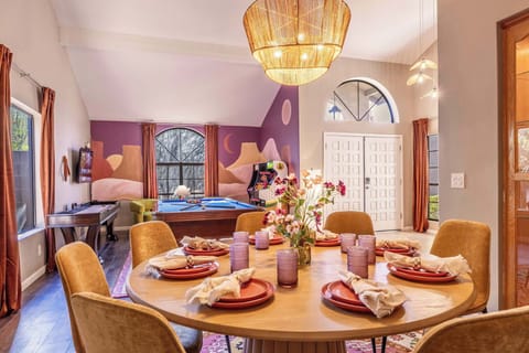 A space made for connection—the dining table seats 10 comfortably, and just across the room, sunlight spills into a game lounge with arcade vibes. It’s all set up for good food, great company, and nights that turn into stories.
