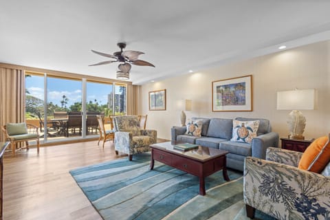 Relax in your airy living room where island breezes and sunlight pour through floor-to-ceiling windows. Sink into plush seating and step onto your private balcony to take in lush views.