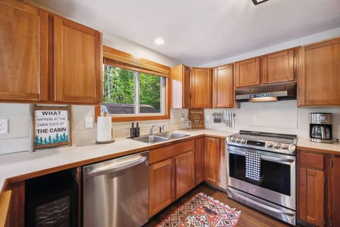 Fully equipped kitchen with modern stainless steel appliances.