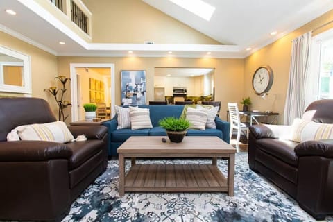 Open living and dining space with a comfy sleeper sofa for extra guests.