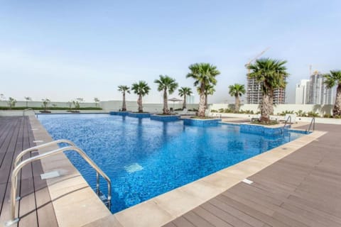 Poolside Paradise: Dive into luxury with stunning views and refreshing palm-fringed relaxation!