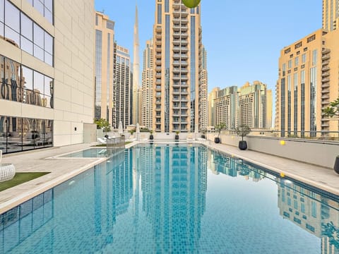 Rooftop Oasis: Dive into luxury with stunning views and a refreshing pool experience!