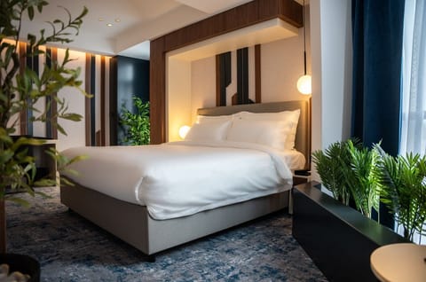 Deluxe Room | In-room safe, blackout drapes, iron/ironing board, free WiFi