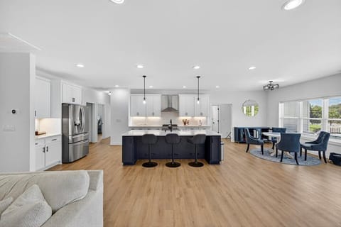 Fully stocked and ready to serve—cook with lake views in this open-concept kitchen.